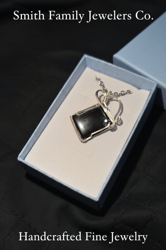 Beautiful hematite pendant, wrapped in silver - plated 20 ga. square wire