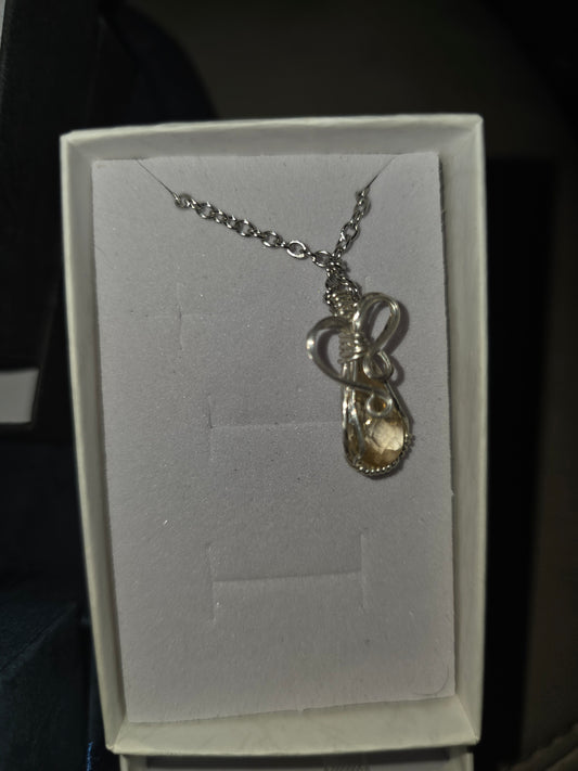 citrine pendent with 22 ga. silver plated wire wrapping and silver plated chain